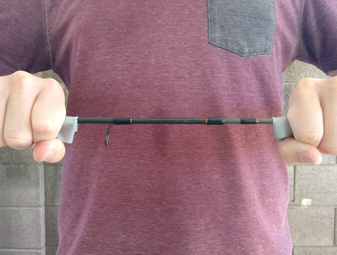 Use duct tape to pull apart a stuck fishing rod.